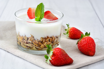 Yogurt with cereals,strawberries and milk