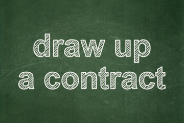 Obraz premium Law concept: Draw up A contract on chalkboard background