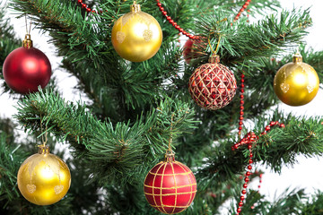 Christmas tree with baubles on white background.