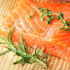 Raw salmon on cutting board