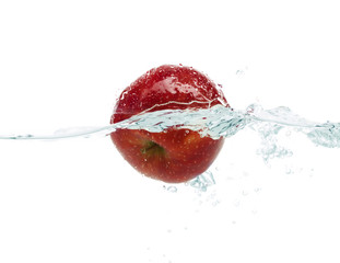 apple falling or dipping in water with splash