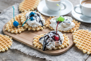 Belgian waffles with whipped cream and chocolate topping