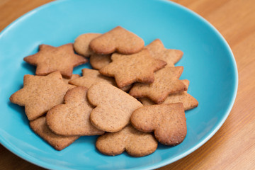 Tasty homemade cookies on blue plate