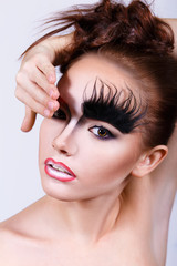 girl with an unusual make-up. Bushy eyebrows. Makeup for Halloween