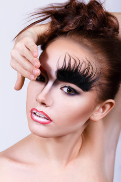 Girl With An Unusual Make-up. Bushy Eyebrows. Makeup For Halloween