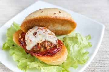 Sandwich with meatball in tomato sauce and mozzarella
