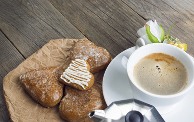 Heart shaped cookies , cup of coffee, bouquet of flowers decorat