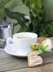 Heart shaped cookies , cup of coffee, bouquet of flowers decorat