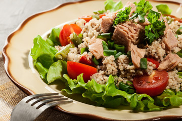 Tasty salad with couscous, tuna and vegetables