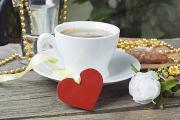 Heart shaped cookies , cup of coffee, bouquet of flowers decorat