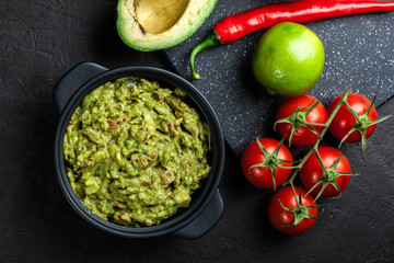 Bowl of guacamole with fresh ingredients