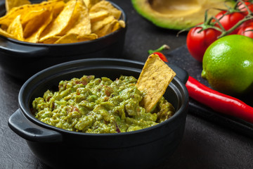 Bowl of guacamole with corn chips