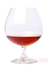 Glass with cognac on white background