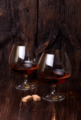 Chocolate truffles with cognac glass on the table