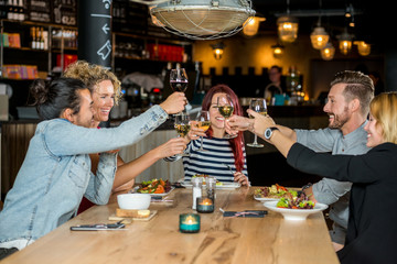 Friends Toasting Wineglasses At Restaurant