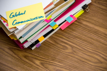 Fototapeta premium Global Communication; The Pile of Business Documents on the Desk