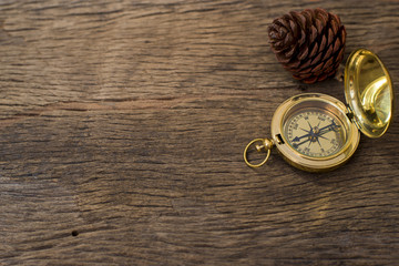 Old Compass on wood background