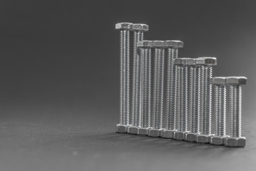 nuts and bolts on a gray background