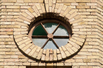round window in a brick building