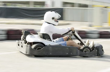 Photo sur Plexiglas Sport automobile Karting driver motion blued