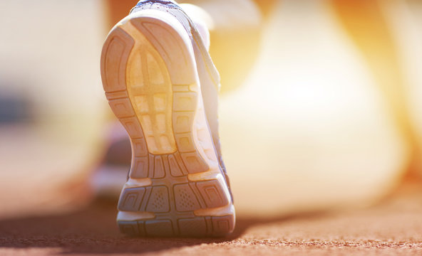 Athlete runner feet running on treadmill.closeup on shoe