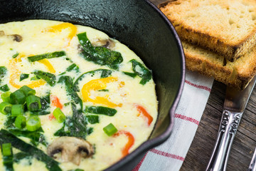 Fresh cooked omelette with vegetables.