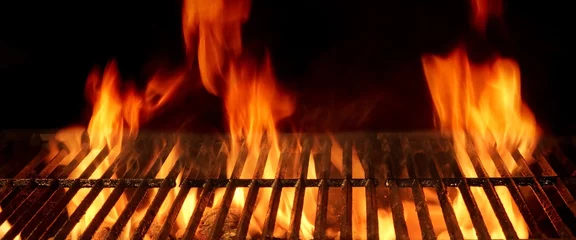 Photo sur Aluminium Grill / Barbecue Empty Hot Flaming Charcoal Barbecue Grill With Bright Flame Isol