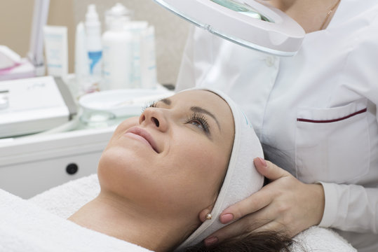 Woman receiving cleansing therapy. Skin care