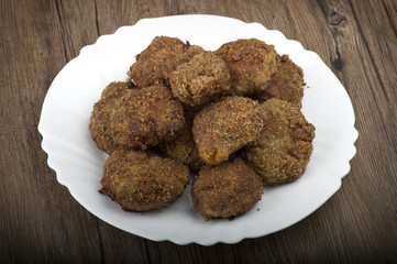 plate of meatballs on the wooden table