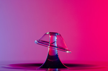 Splash of colored water drops close up