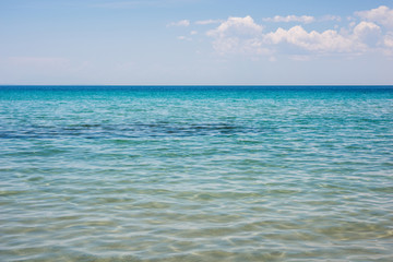 Fototapeta na wymiar Open water , Beach scene showing sand, sea and sky