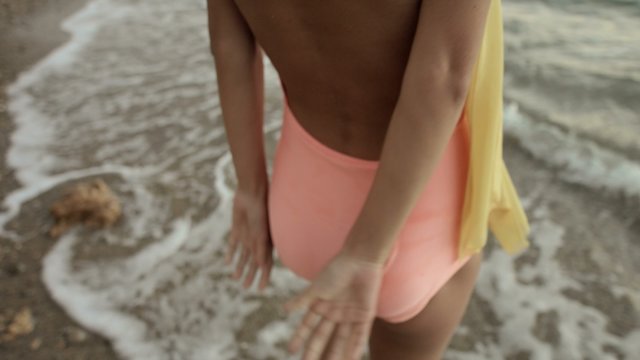 Sensual Girl In Swimsuit Walking Along Seashore