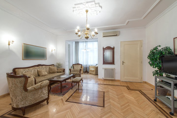 Interior of living room with classic style furniture