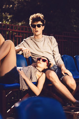 Young couple resting on the podium, lifestyle