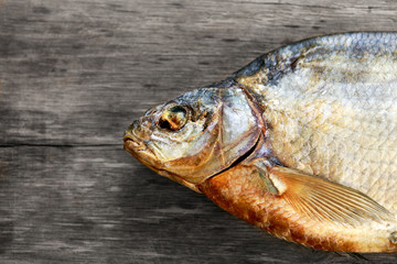 Salted Dry fish vobla on wooden table