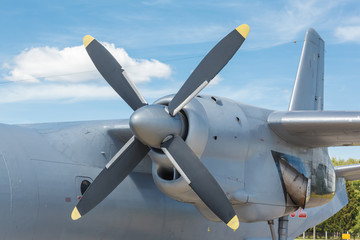 Naklejka na ściany i meble Blue propeller passenger plane close up