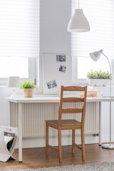 White desk and wooden chair