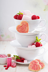 Valentines day sugar cookies in stacked cups