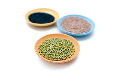 Three bowls with different seeds and selective focus
