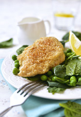 Roasted chicken breast in sesame crust.