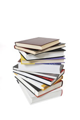 High books stack isolated on white background. Many colorful book covers.