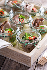 Roastbeef with mashed potatoes in small jars