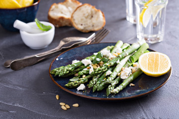 Warm salad with asparagus, feta cheese and lemon