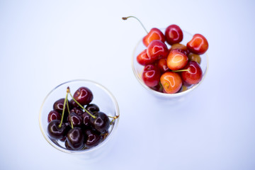 Fresh cherries in bowl on table