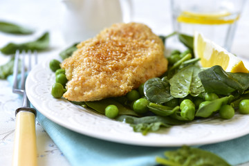 Roasted chicken breast in sesame crust.