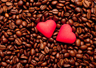 two red hearts on coffee beans
