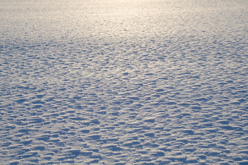  Snow background/ Snow background. Snow erosion.  Lighting from sunset. 
