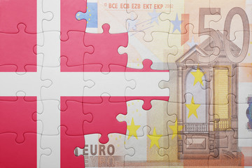 puzzle with the national flag of denmark and euro banknote