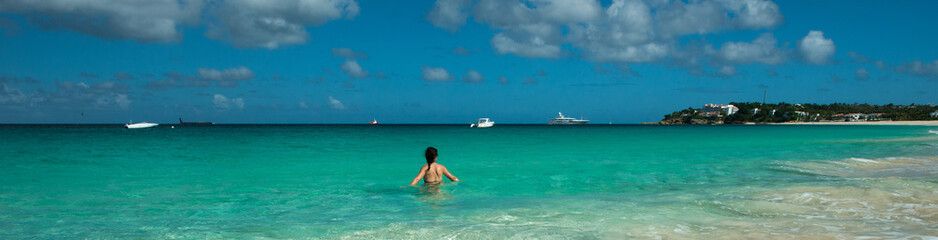 Woman is taking the bath at Caribbean 