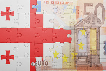 puzzle with the national flag of georgia and euro banknote